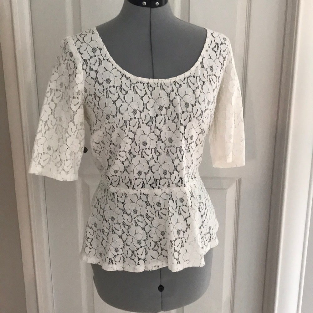 White laced quarter length peplum shirt